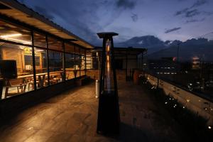 a building with a light on the roof at night at Hotel Casa PARDO Boutique in Bogotá