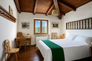 Postel nebo postele na pokoji v ubytování Villa Nasca - Paesaggi e Piscina privata