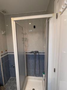 a bathroom with a shower with a glass door at &luxe vista mar& in Calpe