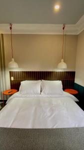 Ένα ή περισσότερα κρεβάτια σε δωμάτιο στο Bendito Hostels