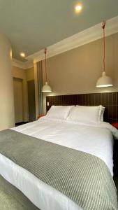 Ένα ή περισσότερα κρεβάτια σε δωμάτιο στο Bendito Hostels +55 φωτογραφίες