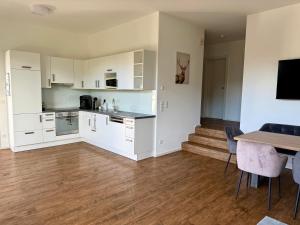 Kuchyň nebo kuchyňský kout v ubytování Apartment P6 Oberndorf direkt an der Piste mit Blick auf den Wilden Kaiser + 9 fotografií