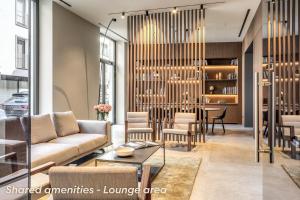 a living room with a couch and a table at Agnesi Statue in Milan