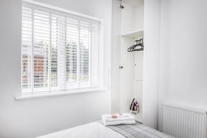 Ένα ή περισσότερα κρεβάτια σε δωμάτιο στο Oak Lodge