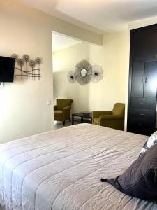 Ένα ή περισσότερα κρεβάτια σε δωμάτιο στο Cozy Apartment at DT Wifi and AC +6 φωτογραφίες