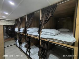 a group of bunk beds in a room at Екохостел in Bishkek