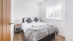 Ένα ή περισσότερα κρεβάτια σε δωμάτιο στο Ash Lodge