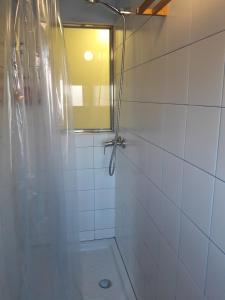 a bathroom with a shower with a mirror at Casa cova de Benifallet in Benifallet
