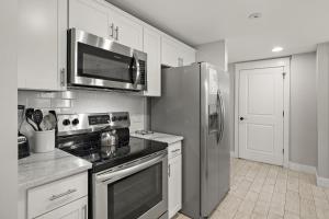 a kitchen with a stove and a refrigerator at Pilot House 413 in Destin
