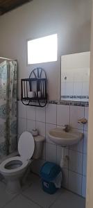 a bathroom with a toilet and a sink at Villa Naylamp Loft 1 playa Pocitas in Máncora