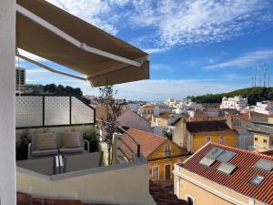 a balcony with a view of a city at BestHomeStay-Santiago do Cacém in Santiago do Cacém
