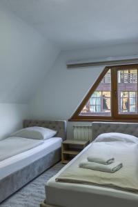 Postel nebo postele na pokoji v ubytování Pansion A&M Vlašić