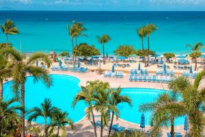 a view of the beach and the pool at the resort at Royal Islander Club Resort La Plage in Lowlands