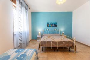 Postel nebo postele na pokoji v ubytování Villa Girasole + 27 fotografií