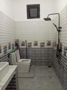 Ένα μπάνιο στο TG Home Stay Villa Ahnagama