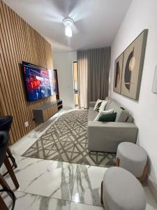 Et tv og/eller underholdning på Apartamento novo e completo