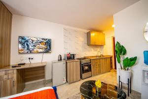 Η κουζίνα ή μικρή κουζίνα στο Marina Cozy guest house +13 φωτογραφίες