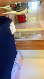a room with a bed and a cupboard with towels at chalé mares in Fortaleza +3 photos