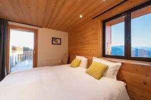 Ένα ή περισσότερα κρεβάτια σε δωμάτιο στο Le Flocon d'Argent