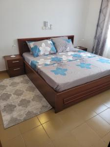 En eller flere senge i et værelse på Résidence Perla