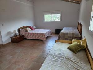 Ένα ή περισσότερα κρεβάτια σε δωμάτιο στο mirador del collao