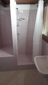 a bathroom with a shower and a sink at Foresteria - Riolo in Schio