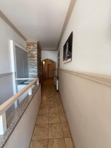 a hallway of a house with a staircase and a hallway at Apartment bei Oberndorf - Schwanenstadt in Schwanenstadt