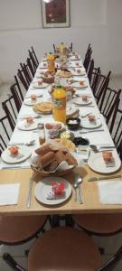 a long table with plates of food on it at Auberge Lion de l'Atlas in Azrou