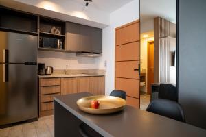 a kitchen with a table with a bowl on it at Paraíso Paulista Flats by Feel Sampa in Sao Paulo