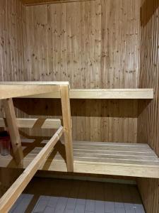 a wooden bench in a sauna at Close to Gothenburg & the sea - with your own sauna! in Billdal +18 photos