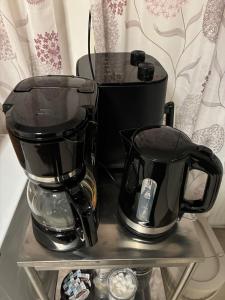 a coffee maker and a blender on a shelf at Close to Gothenburg & the sea - with your own sauna! in Billdal