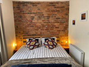 Ένα ή περισσότερα κρεβάτια σε δωμάτιο στο Hope Corner