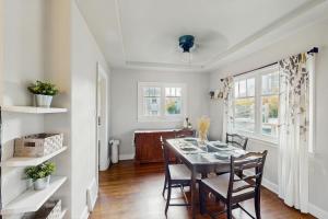 a dining room with a table and chairs at The Jul on State in Bremerton