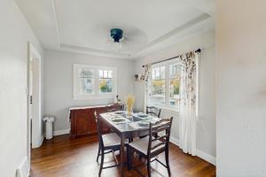 a dining room with a table and two chairs at The Jul on State in Bremerton +10 photos
