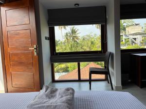 Postel nebo postele na pokoji v ubytování Cozy Corner - Midigama