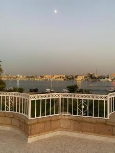 a white railing with a view of the water at Luxor Nile Palace in Luxor