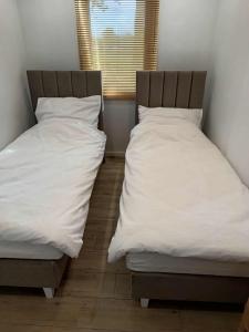 Postel nebo postele na pokoji v ubytování PokojeS12