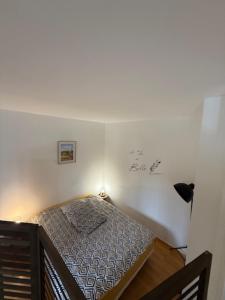 Postel nebo postele na pokoji v ubytování Melusinehof - Studio au coeur de Bailleul