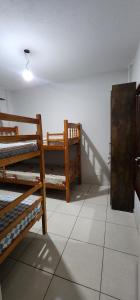 Postel nebo postele na pokoji v ubytování Aconchego da Kelen