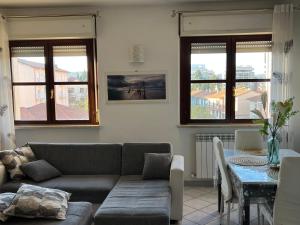 a living room with a couch and a table at Casa BELLOCCHIO in Perugia