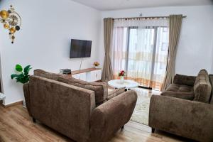 TV a/nebo společenská místnost v ubytování Juwell Haven