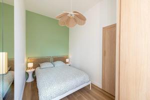 Postel nebo postele na pokoji v ubytování VERDUN - Appartement Cosy - Hyper Centre Menton