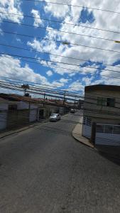 a street with a car parked next to a building at Fully equipped apartment - Jardim Boa Vista in Caruaru