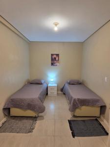 En eller flere senge i et værelse på Apartamento 101 Farol de Santa marta