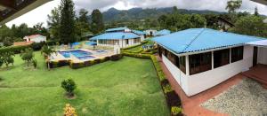 an aerial view of a house with a swimming pool at Villa Del Viento in Calima