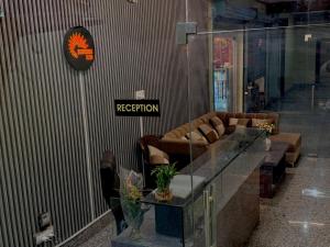 a lobby with a reception desk and couches in a building at SUNRISE INN hotel in Bikaner