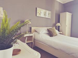 Ένα ή περισσότερα κρεβάτια σε δωμάτιο στο Station lounge