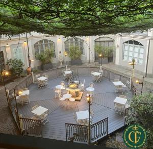 an overhead view of a patio with tables and chairs at Carlo Felice Boutique Hotel in Turin