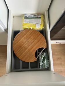a drawer with a wooden cutting board in it at Casa da Vila do Rock in Paredes de Coura