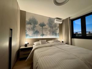 Ένα ή περισσότερα κρεβάτια σε δωμάτιο στο Central Lux Apartment